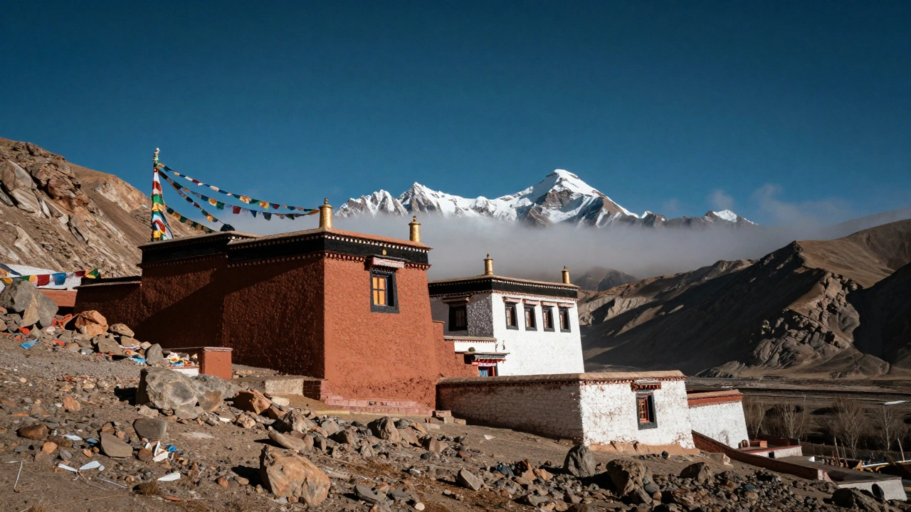 Ancient monastery with colorful prayer flags in barren mountain desert