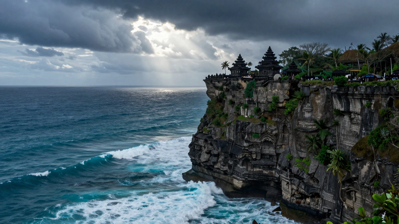 Uluwatu Temple on a cliff edge overlooking crashing turquoise ocean waves